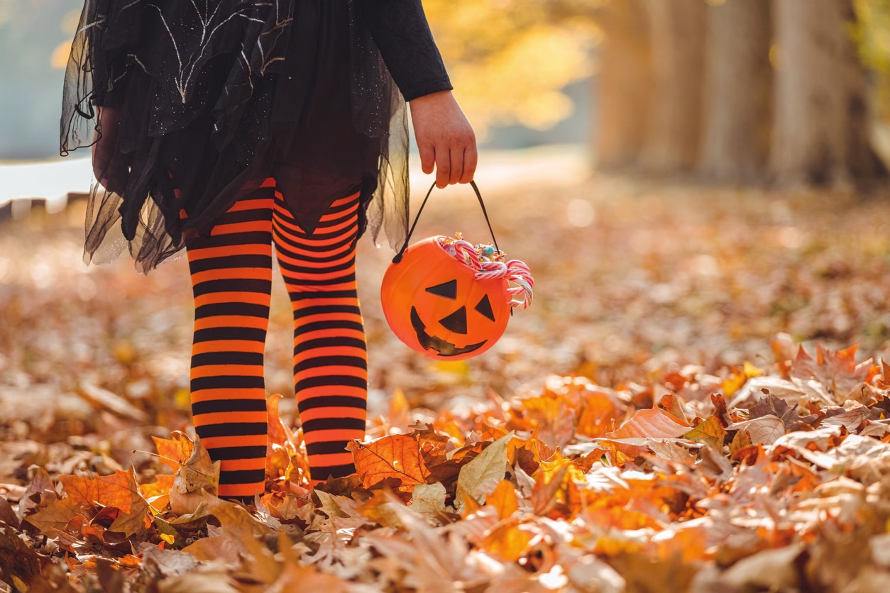 Little girl in Halloween costumes goes to trick or treating